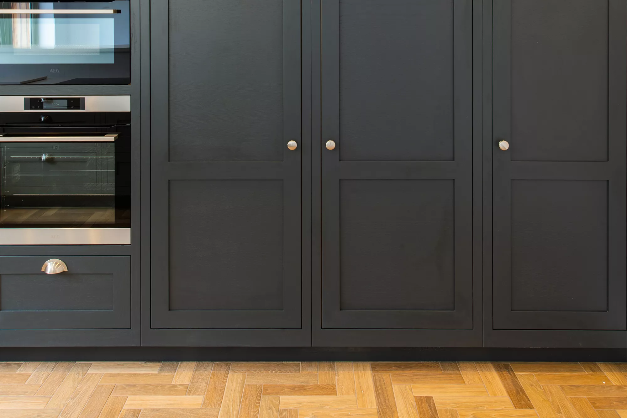 dark coloured shaker style kitchen